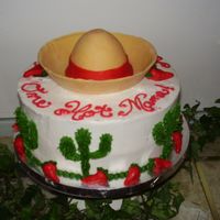 One Hot Mama This was for a Surprise Mexican themed party.The Sombraro is made out of fondant.