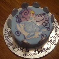 Cinderella Birthday Cinderella Cake covered in fondant with a fondant crown around the outside.