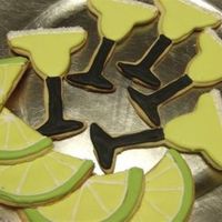 Margarita Anyone? Margarita and limes. Sugar cookies with antonia's icing.