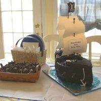 Pirate Ship And Cookies This was for my son's 4th birthday last year. Not a great picture though. White cake with MMF. Accents are all MMF. Sugar cookies with...