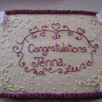 Dsc03013.jpg I took the corner borders from a cake on here. Everything is free hand.The burgundy border around congrats was supppose to be something...