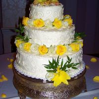 Off-Set Yellow Rose The roses are real. The cake is lemon cake with lemon buttercream icing and blackberry filling. The layers are off-set and line up flat in...