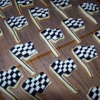 Checkered Flag Penny's sugar cookies, with wilton butter cream. Done with basket weave tip.