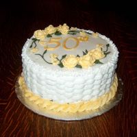 50Th Anniversary - Side View Side view of cake, showing basketweave and rope border on bottom. I used a drop flower tip (forget the number) for the top border. Iced in...