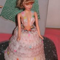 Doll Cake I made this for my daughter with Mm fondant. It's my experiment in decorating ,not perfect but was satisfied with it.