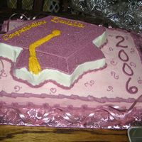 The Pink Graduate Highschool Graduation Cake (her favorite color was pink). Buttercream Icing, with white edible glitter. Mortarboard cake pan on top of a...