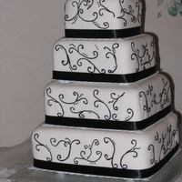 Simply Black & White 4 Tiered Wedding Cake. Stacked Construction. Buttercream covered in fondant with black scrollwork. I was petrified to decorate this cake...
