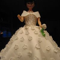 Bridal Shower my first try on the wilton doll...its carrot cake covered in MMF. All Flowers are done in MMF.thanks for looking...