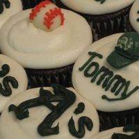 Baseball Cupcakes end of season treat for little league team. chocolate fudge cupcakes with buttercream icing. A's logo piped in royal icing. balls and...