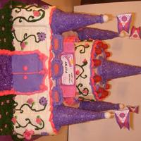 3D Princess Castle 6" cake for the castle tower, 10" cake for the castle base, all done in BC icing. Sugar cones with purple icing rolled in purple...