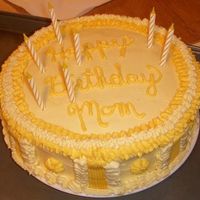 All Yellow Mom's B-Day Cake This was done for a client whose mother LOVED yellow. Its a 2 layer 8" yellow cake with butter cream icing. Tried to make a design...