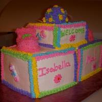 3D Baby Blocks These are 3- 3 layer 6" square cakes al;l with BC icing. The rattle is made and shaped from truffle mix and a lollipop stick and...
