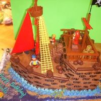 3D Pirate Cake This is a 1/2 sheet cake cut and shape to a pirate ship.....got a bonus on this cake, the client brought me the ENTIRE pirate ship kit so I...