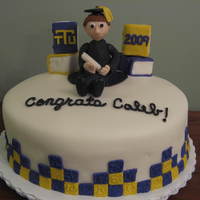 Graduation Cake I made this for my husbands college graduation. The cake is covered in homemade fondant (my first attempt at making it from scratch). Books...