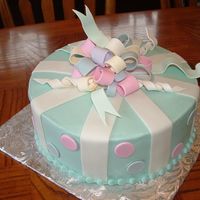 Katelyn's First Birthday Another loopy bow cake. I still like these, even after having done so many! Fondant and gumpaste bow, fondant dots.