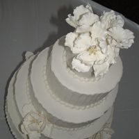 White Wedding With Fantasy Flowers This was my favorite wedding cake to do, so far. Maybe it's because I had the whole day to do it, and no one bothering me! All...