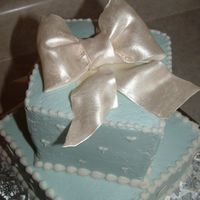 Another Package Cake Gumpaste bow, painted with luster dust. Buttercream icing.