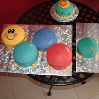 Baby Einstein Caterpillar This was done for a 1st birthday. Cake is 5-6" rounds, decorated in buttercream. The hearts were at his mom's request, because...