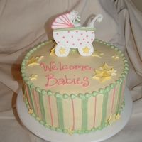 Baby Shower For 2 Buttercream frosting. Baby carriage and stars are a combination of gumpaste and fondant pieces.