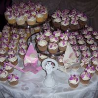 Orchid Wedding Cupcakes My first wedding cake order! 12 dozen orchid cupcakes for an Asian-themed table display.