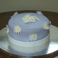 Daisey's My first MMF cake!! Cake is WASC with Chocolate Hazelnut BC. Covered in MMF with Royal Icing flowers