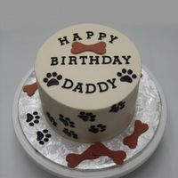 Dog Paw Print Cake This was 2 6" rounds stacked. Covered in buttercream, with fondant accents.