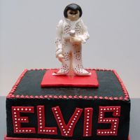 Elvis This is an 8" square cake with a 50/50 Elvis figure. "Elvis" is fondant with white bc dots. The black on the cake was...