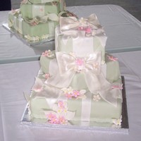 Wedding Gift Square vanilla filled with bc, cakes covered with mmf, with mmf ribbons, bows and flowers.