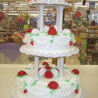 July Wedding Cake this cake is frosted with buttercreme, buttercreme roses. My third wedding cake. It took my quite awhile to do. Was nervous the whole time...