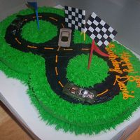 David's Cake All buttercream race track cake... I made the flags out of paper & lollipop sticks. I finally got to use the grass tip for the first...