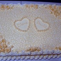 Simple Wedding/anniversary Cake Full sheet cake: Buttery cake with french vanilla filling and buttercream frosting.