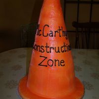 Baby Under Construction Baby shower had a construction theme so the client wanted the cake to look like a construction cone. Built the cake with 2, 8" rounds...