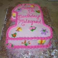 #1 Birthday Cake Dark Chocolate Cake with Chocolate Creme filling. Shaped like the number 1 for first birthday. Used napkin as inspiration for the design.