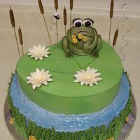Frog N Flowers Made for a friends B-Day. Two layer, BC with MMF accents, water has piping gel for added shine, cattails are spaghetti with MMF, the frog...