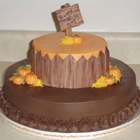 Fall Birthday 16 inch spice cake w/ milk chocolate frosting. Second layer 10 inch lemon cream cake w/ bc frostong. MMF fence, pumpkins and sign.