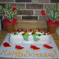 Burrito I made this 'burrito' cake for a Cinco de Mayo birthday party alongwith 2 chili pepper/cactus cookie bouquets. Its a margarita...