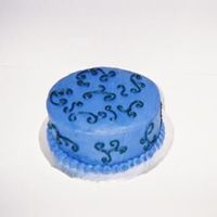 Swirls I had extra chocolate batter and purple & black icing. So, I practicedscrolls and took the cake to work.