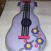 Guitar Birthday Cake Cake made of fondant with butter cream icing.