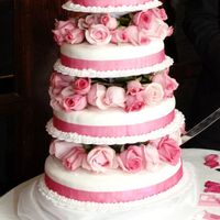 My First Wedding Cake Used the tall-tier cake stand with real flowers.