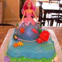 Underwater Barbie Fairy 12 inch cake covered in fondant. Gumpaste pearls, shells and sea flowers.
