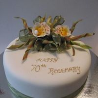 70Th B'day, Corkscrew Orchid - Female 70th Birthday cake for my neighbour. Caramel Mud Cake. Corkscrew Orchid (Trichophilia Tortilis) made in class. Simple ribbon edging.