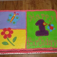 Addison's First I've been dying to do one of the Hugs n Stitches cakes. Iced in buttercream with MMF one, butterfly, and flowers.