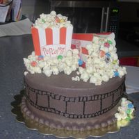 Movie Night This was my first time trying this theme. The cake is yellow buttercream and the icing dark choc buttercream. The popcorn mixture is plain...