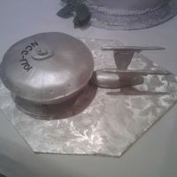 Starship Enterprise This was a grooms cake for a star trek fan. Cake is covered in fondant and painted with silver lusterdust.