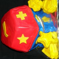 Shape Sorter Cake For a first birthday....I carved it myself and made the shapes out of dried fondant.