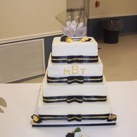 Black & Gold Wedding Buttercream icing with real ribbon trim. I very much dislike square cakes now!!! LOLInitials are coated with gold luster dust.