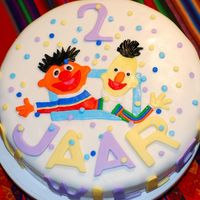 Bert And Ernie i had to make this cake for a boy who loves Bert and Ernie. When he saw the cake he was so happy, he almost cry when they cut the cake.