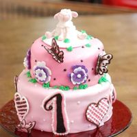 Birthday Cake i made the sheep with gumpaste, the hearts and the number are made with royal icing.