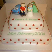 Football Fans Wedding Cake 12" and 8" square cakes stacked. The bride was a Manchester City fan (blue) and the groom Manchester United (red). They also...