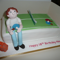 Table Tennis Cake Table Tennis figure made from sugarpaste. Cake covered with sugarpaste